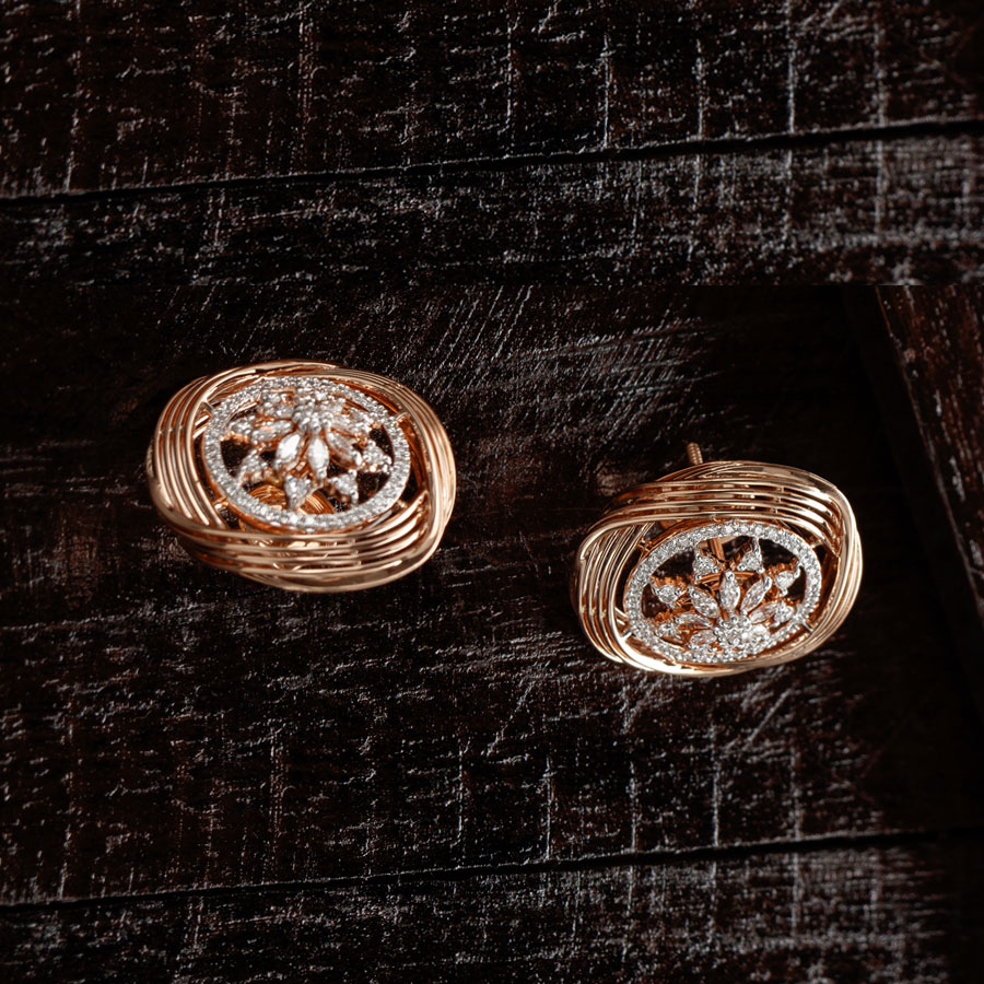 Rose Gold and Diamonds Sunshine Earrings on brown wooden background