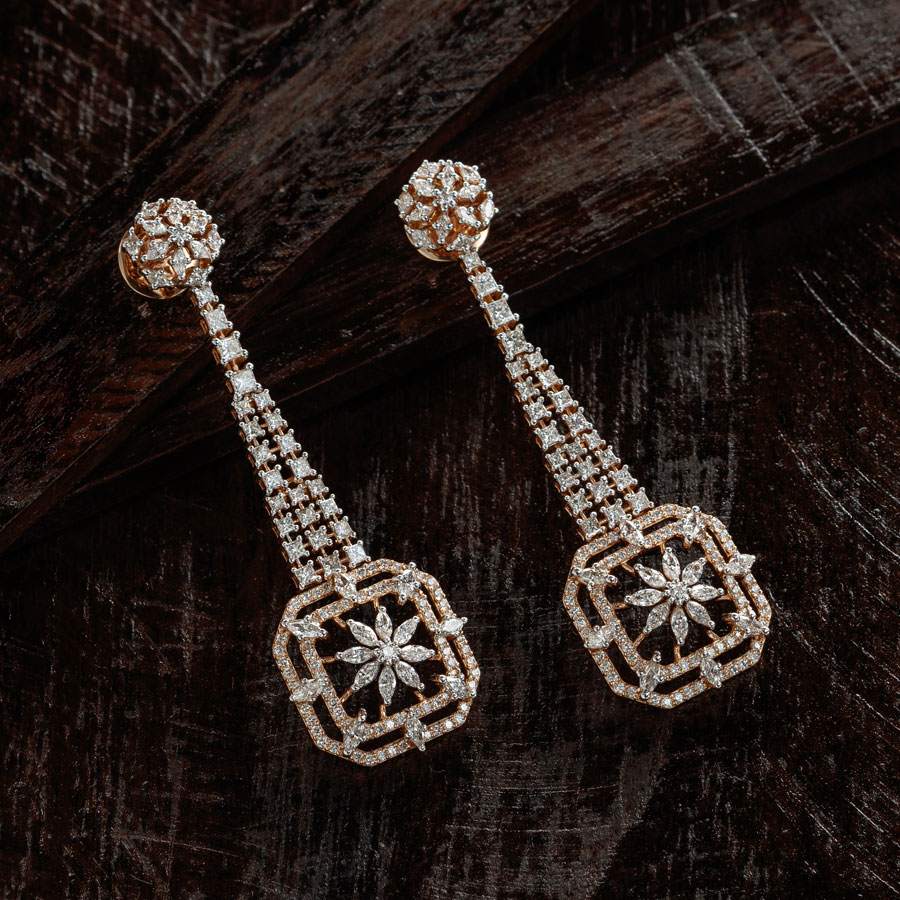 Pear strings and diamond and pearls floral motif necklace on black background