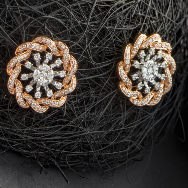Coiled Rose Gold and Diamonds Earrings on a ball of black thread