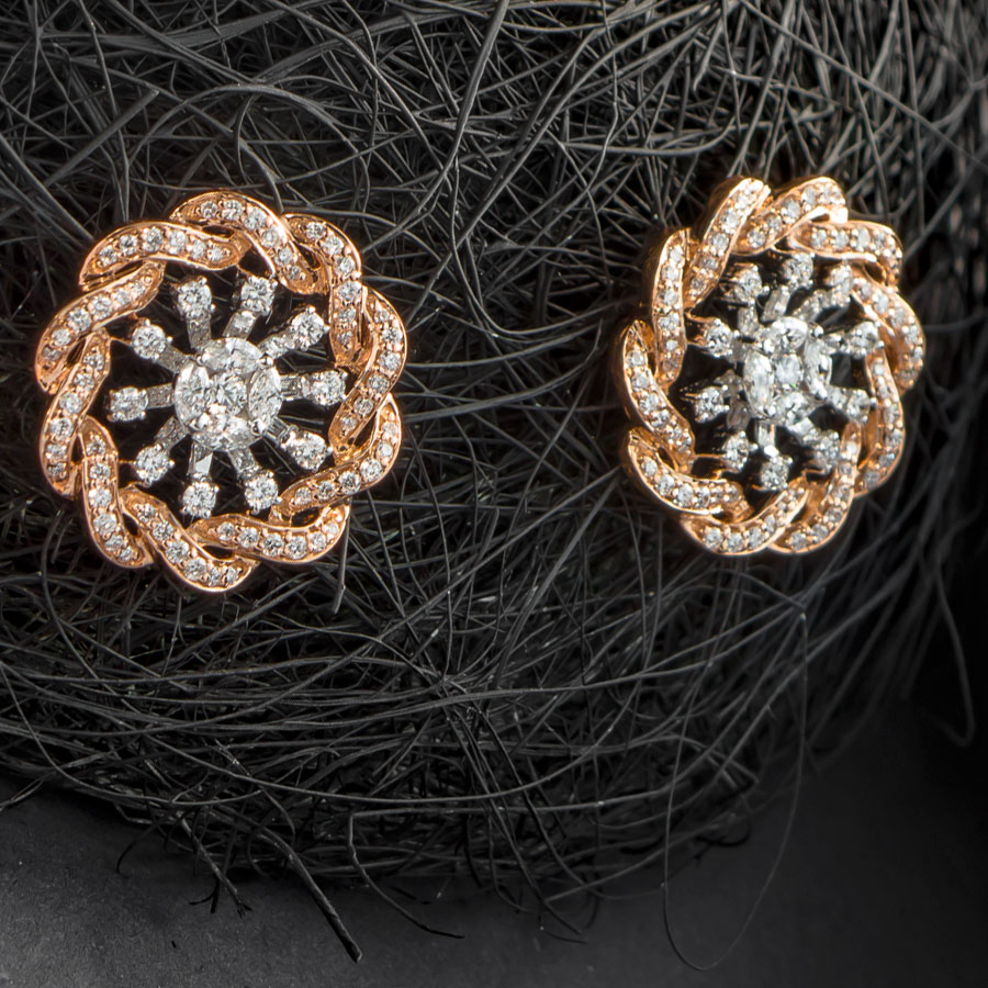 Coiled Rose Gold and Diamonds Earrings on a ball of black thread