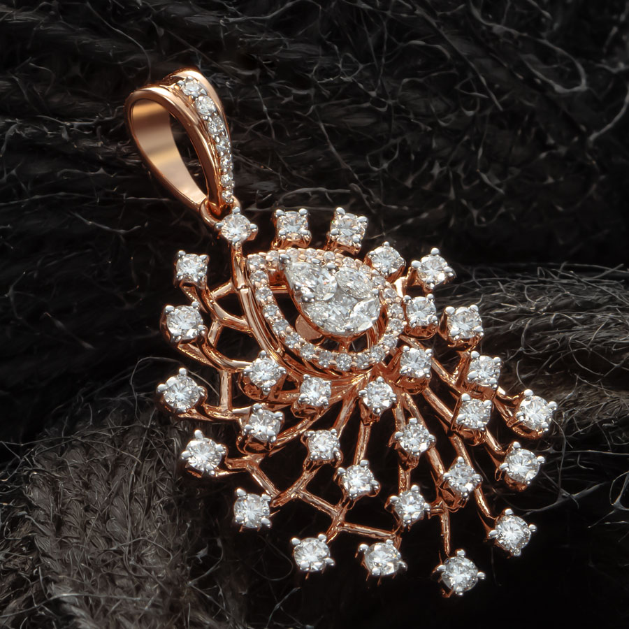 Rose Gold and Diamond Pendant on a dark surface