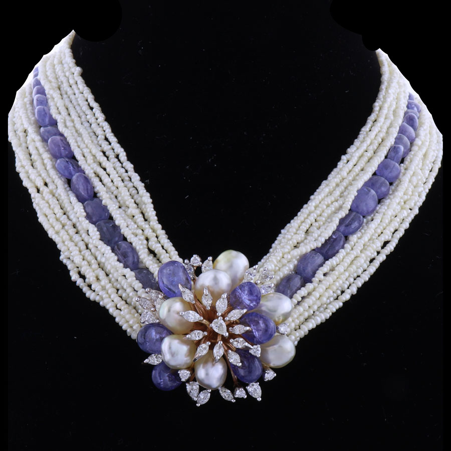 Blue and White Pearls and Diamonds Necklace on a black background