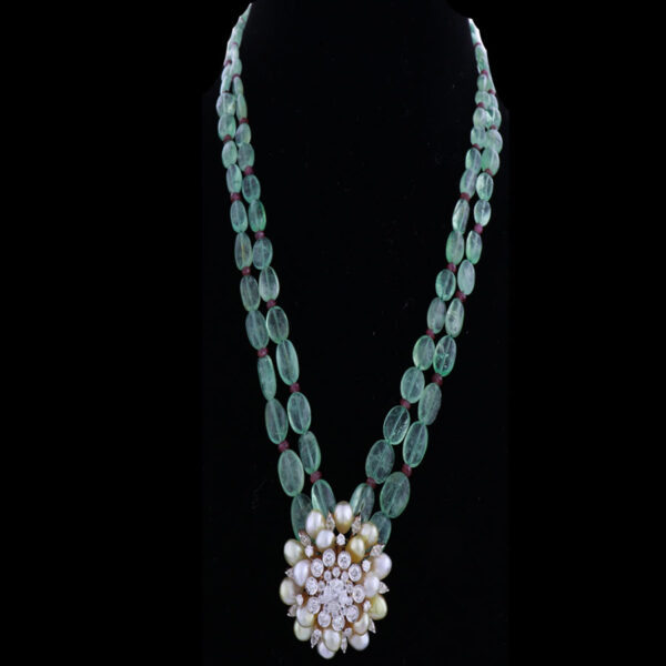 Emerald Green Pearls Necklace with Gems and Diamonds Pendant on a black background