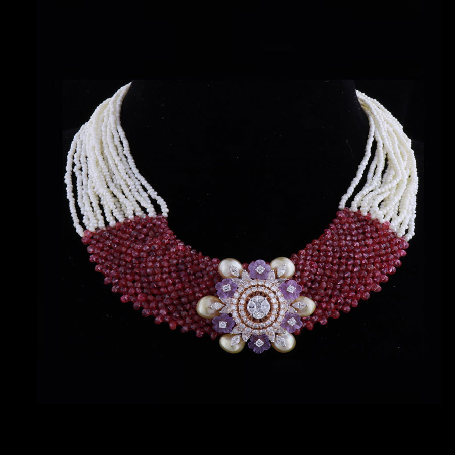 Diamond, Pearls and Gems Necklace on a black background