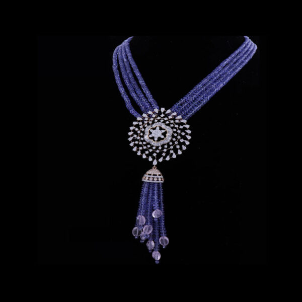 Blue and White Diamond and Pearl Floral Necklace on a black background