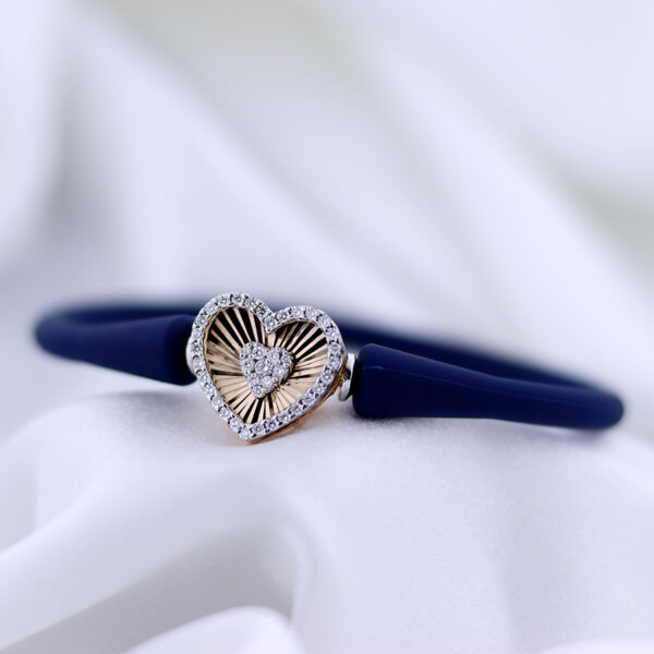 Diamond and Rose Gold Heart Bracelet on white satin background